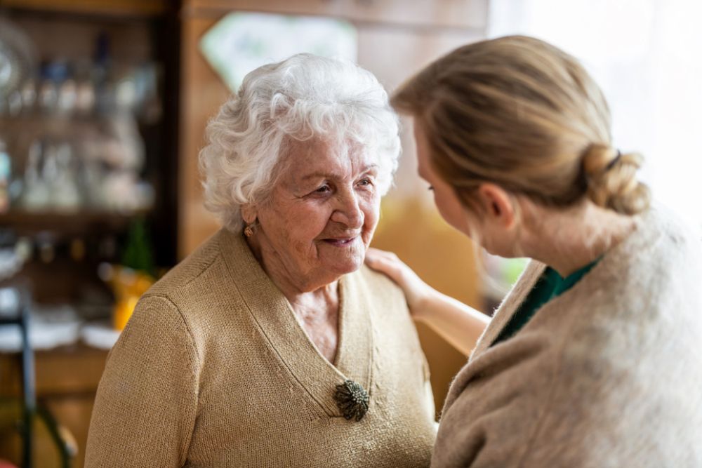Woman talking to older lady